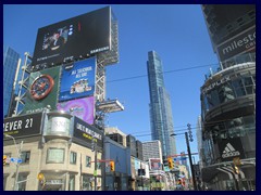 Dundas Square with billboards and the 78-storey Aura skyscraper (built2015)